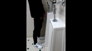 Dude at Gigantic Urinals