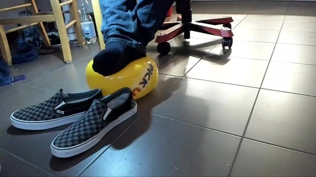 Male Shoeplay with Beach Ball in under Armor, Vans Slip Ons, Black Socks