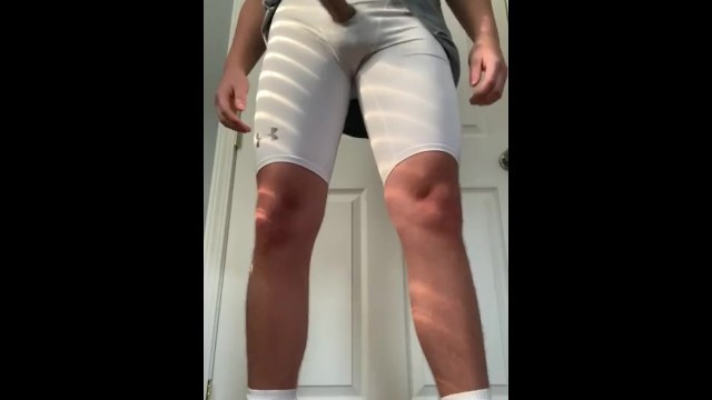 Football Jock Plays with Dick through Compression Shorts Hole