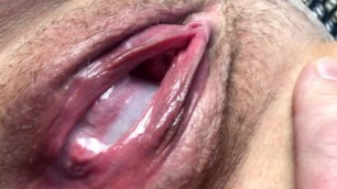 Cum Flows from a Meaty, Swollen and Fucked up Pussy. Close-up.